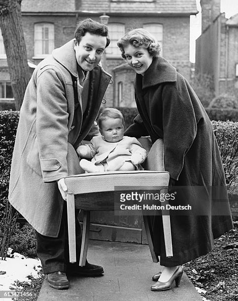 English comic actor Peter Sellers moving into his new home with his wife and son, Muswell Hill, London, 1955.