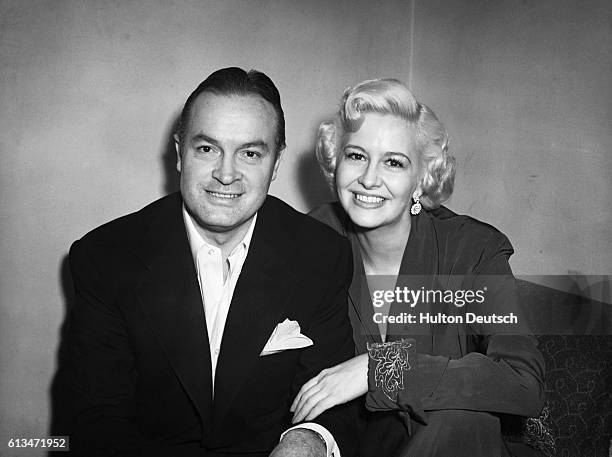The American comedian and actor Bob Hope, rests between shows with the singer and actress Marilyn Maxwell, at the Prince of Wales Theatre, 1951.