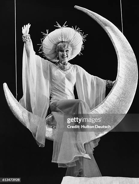 Full-length portrait of Ginger Rogers, born Virginia McMath, playing the lead in "Mame". Here she is wearing the 'Moon-Lady' costume, a gown of...