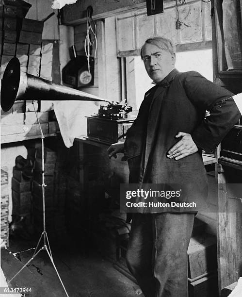 American inventor and businessman Thomas Edison with an Edison Standard Phonograph, at his lab in West Orange, New Jersey, 1906. The Edison Standard...