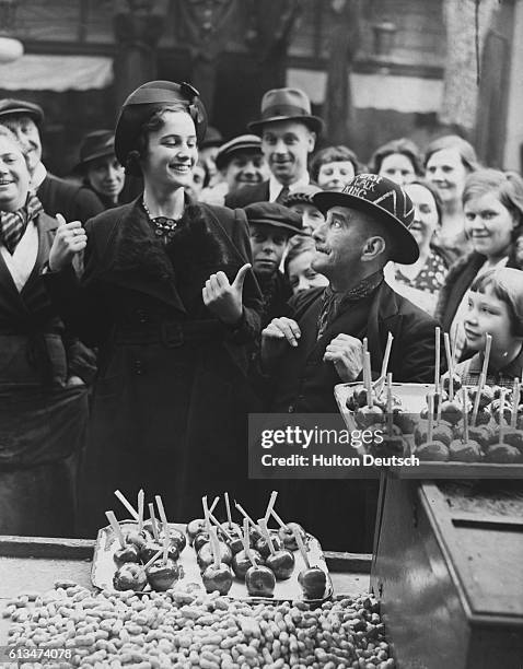 Miss Irene Dipper, The Queen of Lambeth Walk with Billy Pease The Toffee Apple King at Lambeth Sunday market.