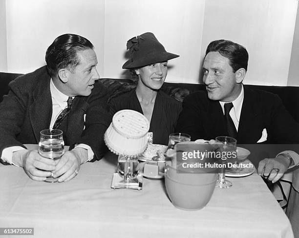 American film actor Spencer Tracy with MGM scout Bill Grady and a female companion at the Trocadero, Hollywood.