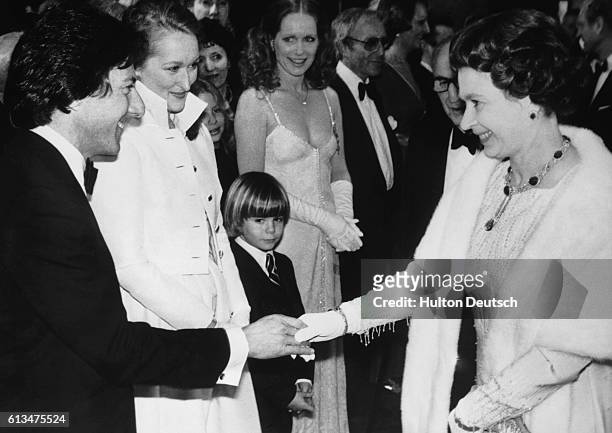 American film actor Dustin Hoffman shakes hands with Queen Elizabeth II at the Royal premiere of Kramer Versus Kramer, London, 1980. Hoffman won an...