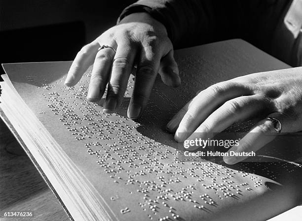 Man Proofreading Braille Text