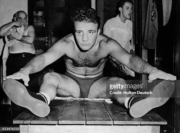 Jake La Motta, the middleweight title holder, exercises at Gleason's Gym, New York, in preparation for his title fight against Marcel Cerdan. USA,...