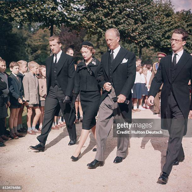 Former King of Belgium Leopold III visits the tomb of his first wife, Queen Astrid, with his children King Baudouin I, Crown Prince Albert and...