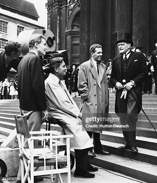 The filming of the memorial service scene for 'Lawrence of Arabia'. Peter O'Toole stands by the camera to watch the scene, the director, David Lean,...