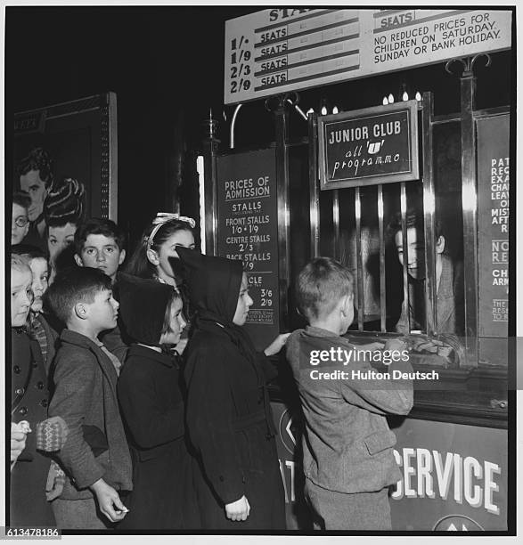 Children queuing to buy tickets for the Saturday morning cinema showing at the State Theatre in Kilburn.