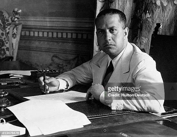 Count Galeazzo Ciano, Mussolini's foreign minster and son-in-law at his desk in Palazzo Chigi, Rome in 1937. | Location: Palazzo Chigi, Rome, Italy.