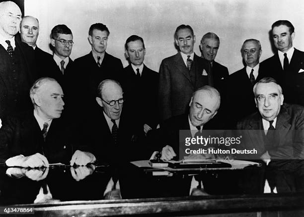 In a ceremony at the Department of State, the $4 billion British Loan Agreement was formally signed. Pictured during the signing are, left to right:...