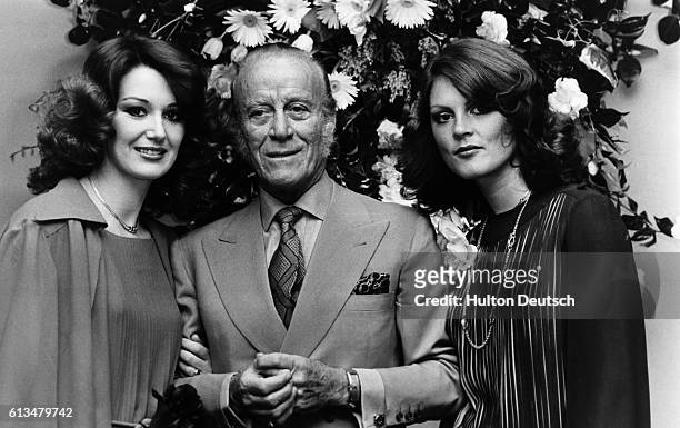 The Italian fashion designer Aldo Gucci with two females at the opening of his new store on Bond Street in London, 1977.
