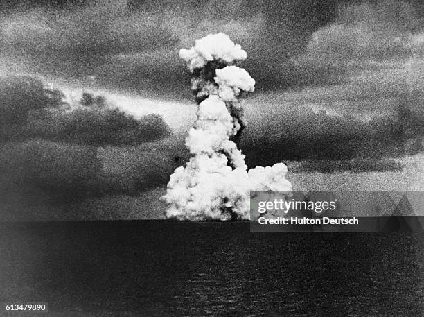 Towering plume of pyroclastic material ascends from Krakatau during an eruption.