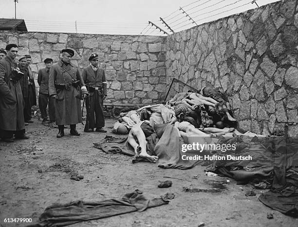 The bodies of dead prisoners are heaped on the ground at Mauthasen concentration camp near Lintz in Austria.