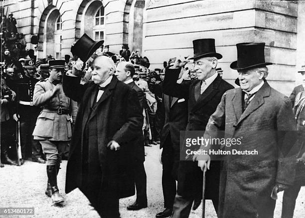 French Premier Georges Clemenceau, American President Woodrow Wilson and British Prime Minister Lloyd George after signing the treaty of Versailles...