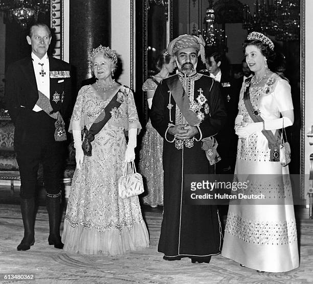 The Sultan of Oman, His Majesty Qaboos Bin Said, with the Duke of Edinburgh, the Queen Mother and the Queen, before a banquet held in his honour at...