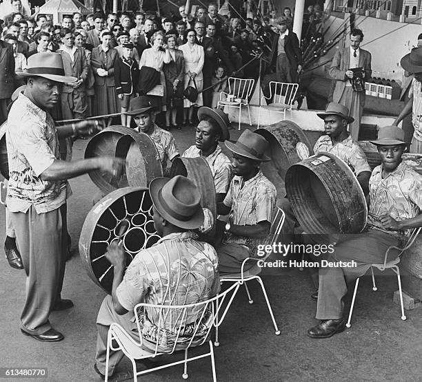 The Trinidad All Steel Percussion Orchestra, gives its first public performance in London at the South Bank under the leadership of their Manager,...