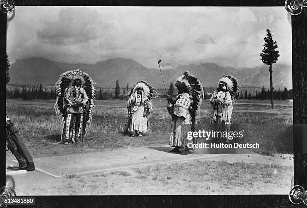 Native Canadian chiefs Sitting Eagle, and Black Buffalo and their wives play a round of golf at Banff Springs in 1927. The chiefs and Mrs. Black...