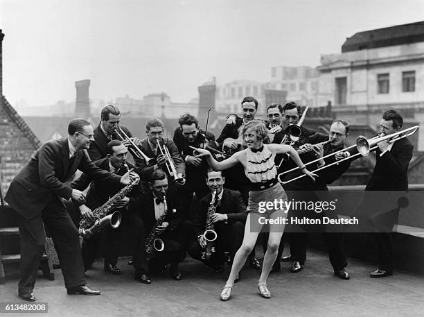 The Percival Mackey Dance Band rehearsing with Monte Ryan on the roof of the Savoy Hotel in London.