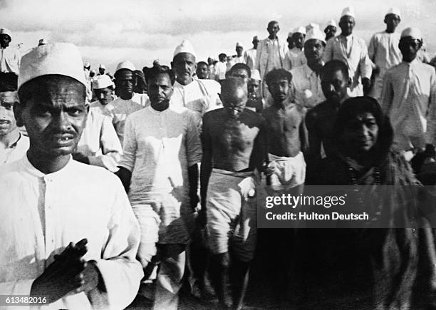 Original caption: Gandhi On The Salt March, 1930. Additional Hulton Text: Protesting against the tax. Information from photo: Gandhi; Mohandas...