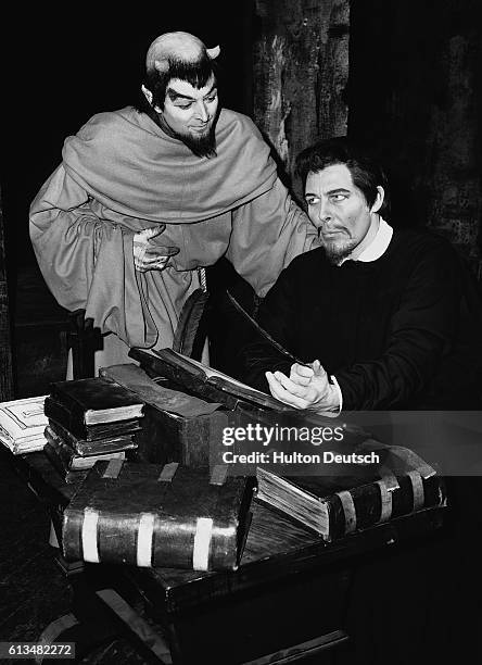 Michael Goodlife as Mephistopheles, and Paul Daneman as Faustus, in a scene from Marlowe's Dr Faustus at the Old Vic.