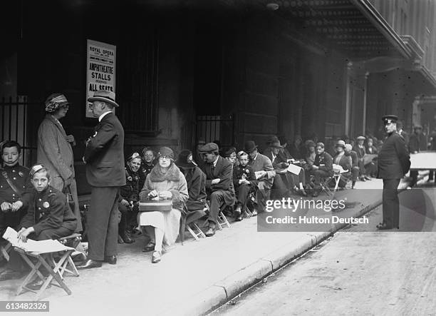 Long line of people queue outside the Royal Opera House at Covent Garden to see the final performance there of the great Australian soprano Nellie...