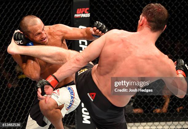 Michael Bisping of England kicks Dan Henderson in their UFC middleweight championship bout during the UFC 204 Fight Night at the Manchester Evening...