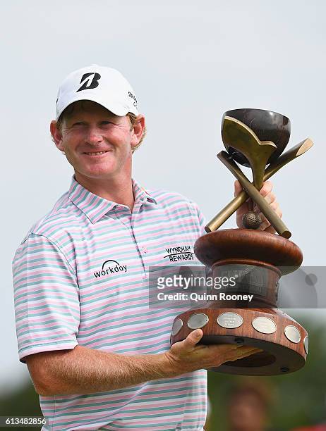 Brandt Snedeker of the USA is presented with his trophy after winning on day four of the 2016 Fiji International at Natadola Bay Golf Course on...