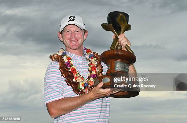 Brandt Snedeker of the USA poses with his trophy after winning on day four of the 2016 Fiji International at Natadola Bay Golf Course on October 9,...