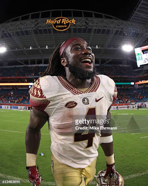 Dalvin Cook of the Florida State Seminoles celebrates after a game against the Miami Hurricanes at Hard Rock Stadium on October 8, 2016 in Miami...