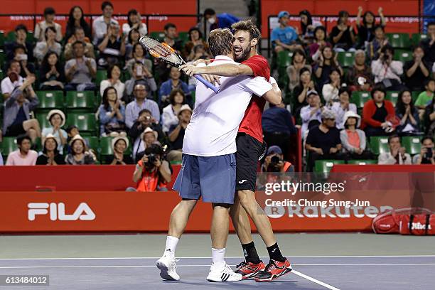 Marcel Granollers of Spain and Marcin Matkowski of Poland celebrate after winning the men's doubles final match against Raven Klaasen of South Africa...