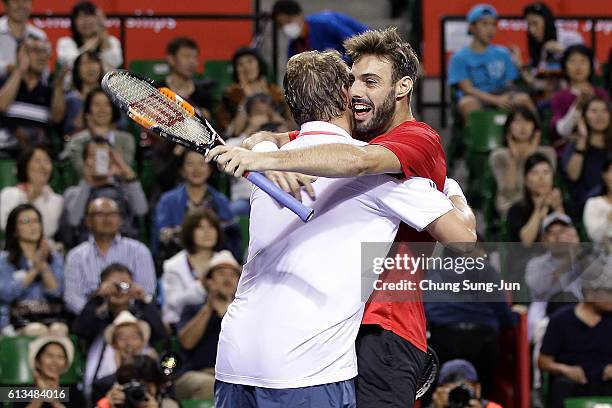 Marcel Granollers of Spain and Marcin Matkowski of Poland celebrate after winning the men's doubles final match against Raven Klaasen of South Africa...