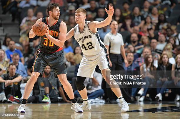 Ryan Kelly of the Atlanta Hawks handles the ball against Davis Bertans of the San Antonio Spurs on October 8, 2016 at the AT&T Center in San Antonio,...