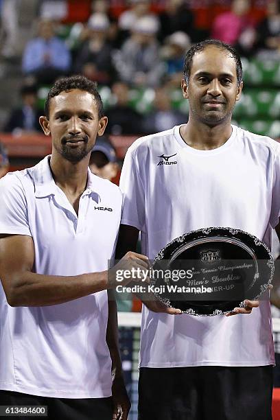 Runners-up Raven Klaasen of South Africa and Rajeev Ram of United States pose with the plate after losing the men's doubles final match against...