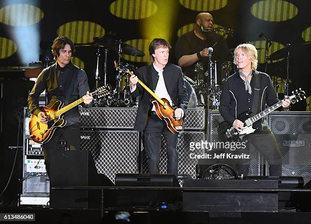 Guitarist Rusty Anderson, Sir Paul McCartney and Brian Ray perform onstage during Desert Trip at the Empire Polo Field on October 8, 2016 in Indio,...