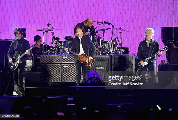 Guitarist Rusty Anderson, Sir Paul McCartney and Brian Ray perform onstage during Desert Trip at the Empire Polo Field on October 8, 2016 in Indio,...