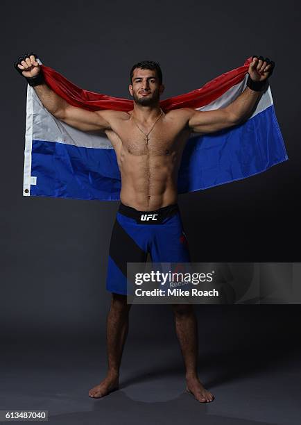 Gegard Mousasi of The Netherlands poses for a post fight portrait backstage during the UFC 204 Fight Night at the Manchester Evening News Arena on...