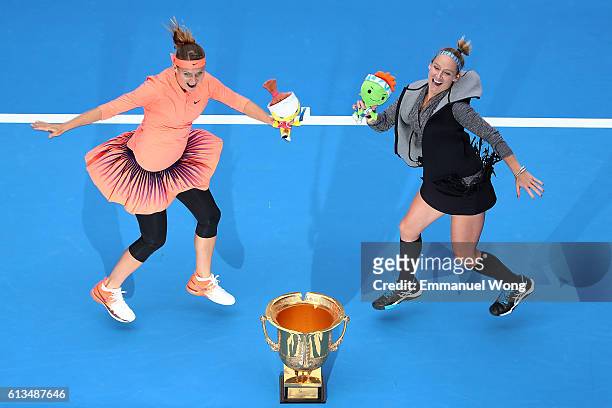 Lucie Safarova of Czech Republic and Bethanie Mattek-Sands of the United States pose with their trophy after winning the Womens's doubles final match...