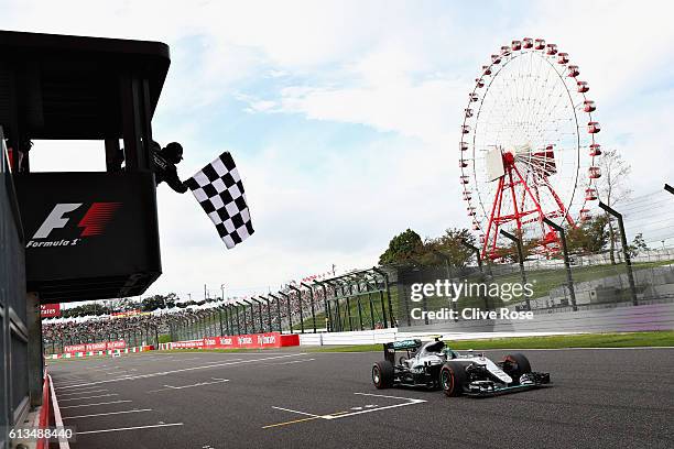 Nico Rosberg of Germany driving the Mercedes AMG Petronas F1 Team Mercedes F1 WO7 Mercedes PU106C Hybrid turbo crosses the line to take te chequered...