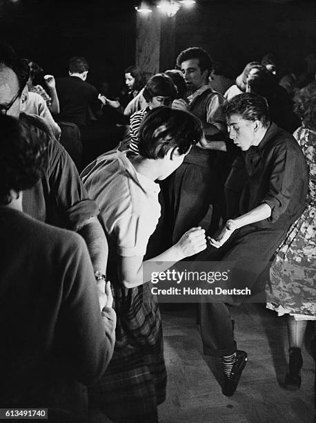 Partners really 'go to town' at a meeting of the London Jazz Club at number one hundred Oxford Street. Humphrey Lyttelton's band provides the rhythm...