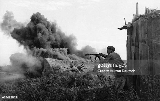 An automatic rifle man fights on the outskirts of the populated area in Stalingrad.