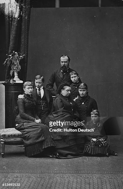 Queen Victoria two months after the death of her daughter Princess Alice. Also shown are Princess Alice's husband and children.