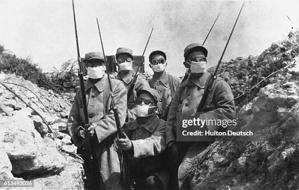 French soldiers wearing early gas masks.