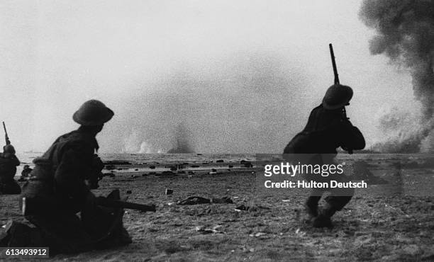 British soldiers in the rear guard try to protect others fighting their way to the coast at Dunkirk, France during an emergency retreat and...