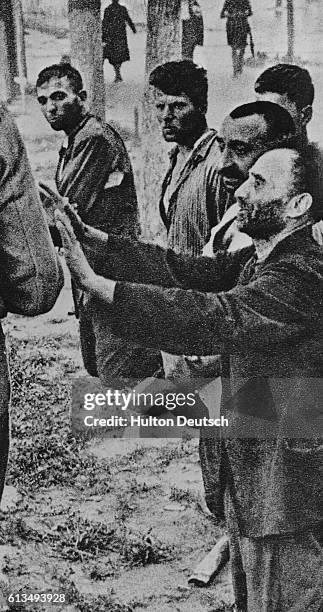 French Patriots Kneeling In Front Of A Nazi Firing Squad In France, Waiting To Be Shot.