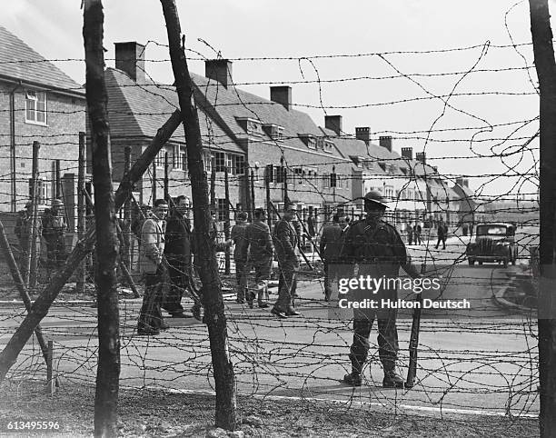 People specified by the government to be aliens are currently interned on a housing estate in Huyton, Liverpool, 1940. | Location: Huyton, Liverpool,...