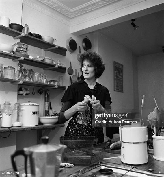 The feminist writer and academic Germaine Greer , author of The Female Eunuch , at home in her kitchen. 1976.