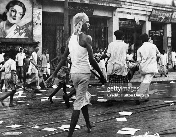 Rioters armed with lathis on the streets of Calcutta. So far over 2,000 people have been killed and at least 4,000 have been injured in communal...