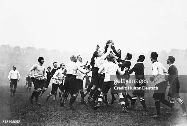 Navy And Army Rugby Football. A Throw In.