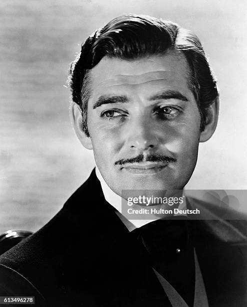 American actor Clark Gable won an Oscar for "It Happened One Night" but made his reputation with his role as Rhett Butler in "Gone With the Wind",...