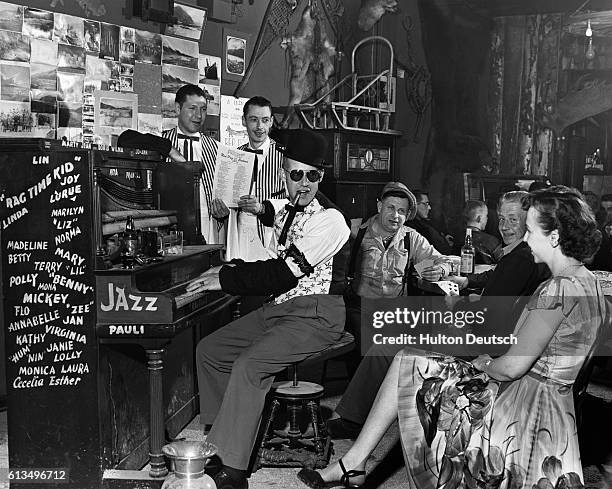 Young woman attracts the attention of a jazz pianist as he entertains customers at the Red Dog Saloon.